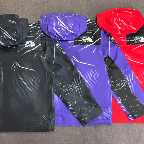 SUPREME THE NORTH FACE TROMPE L' OEIL PRINTED TAPE SEAM SHELL JACKET