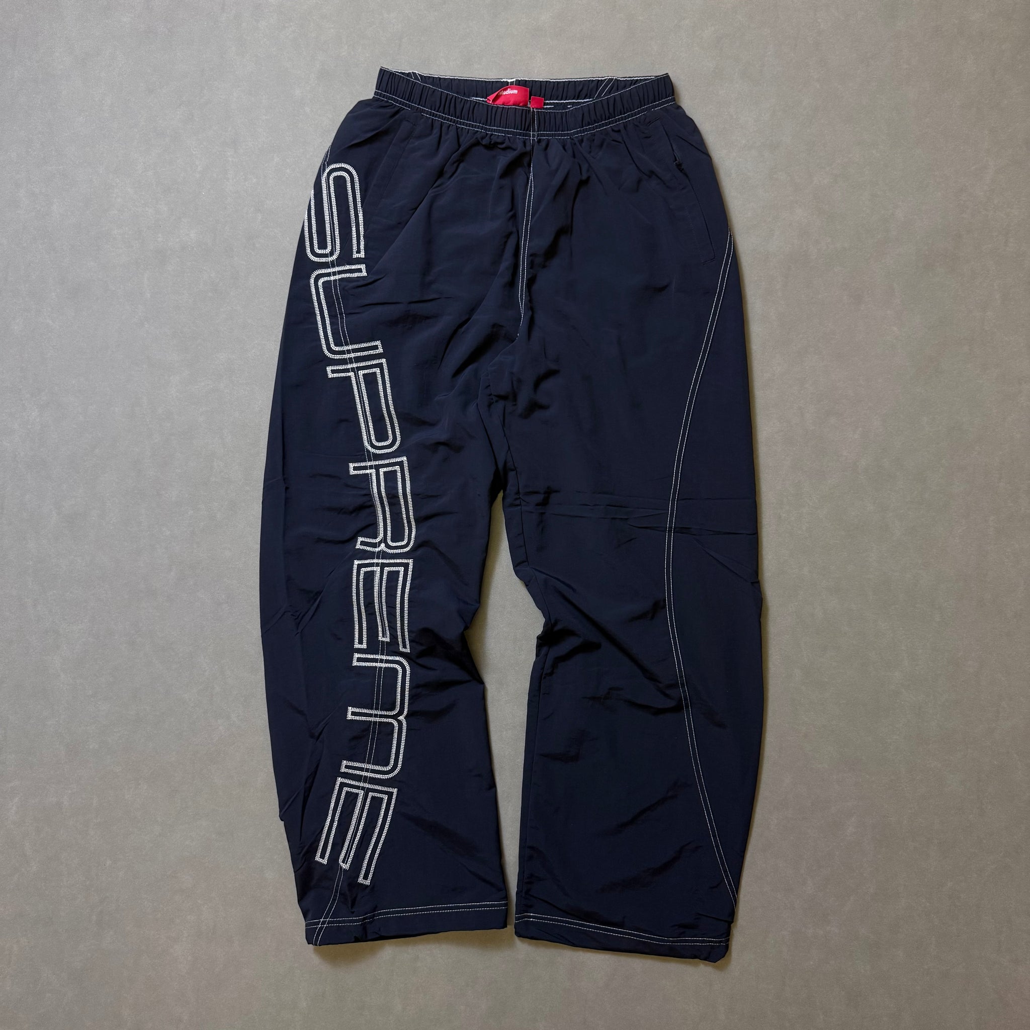 SUPREME SPELLOUT EMBRODIERED TRACK PANT
